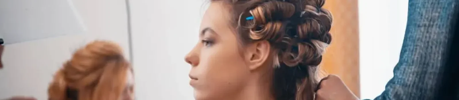 Hairdresser Applying Hair Extensions